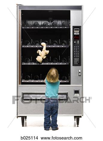 girl buying a teddy bear from a vending machine View Large Photo Image Picture - girl buying a teddy bear from a vending machine. Fotosearch