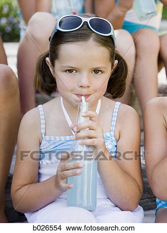 Picture - girl drinking a soda. Fotosearch