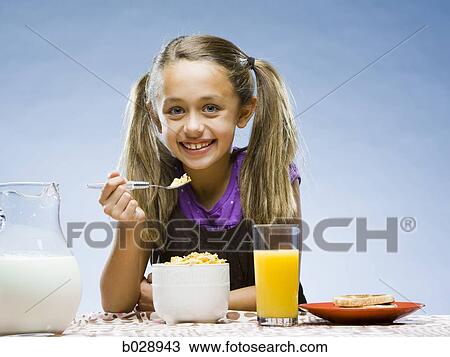 girl eating breakfast View Large Photo Image Stock Image - girl eating breakfast. Fotosearch