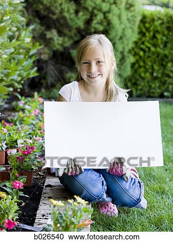 girl holding a blank sign View Large Photo Image Stock Image - girl holding a blank sign. Fotosearch