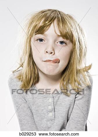 girl looking at the camera sticking out her tongue View Large Photo Image Stock Image - girl looking at the camera sticking out her tongue. Fotosearch
