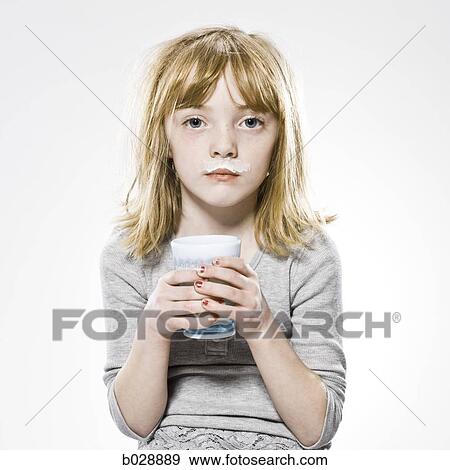 girl looking at the camera with milk mustache View Large Photo Image Stock Photo - girl looking at the camera with milk mustache. Fotosearch