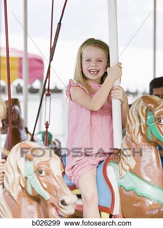girl on a merry-go-round View Large Photo Image Stock Photo - girl on a merry-go-round. Fotosearch