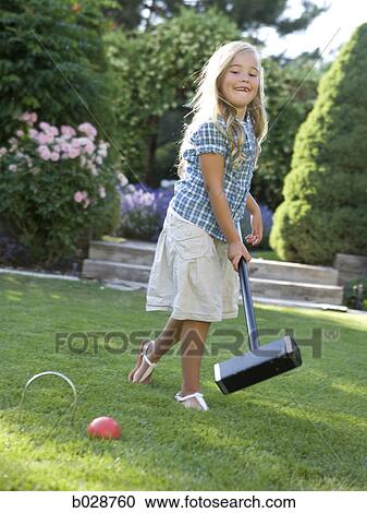 girl playing croquet on the lawn View Large Photo Image Stock Image - girl playing croquet on the lawn. Fotosearch