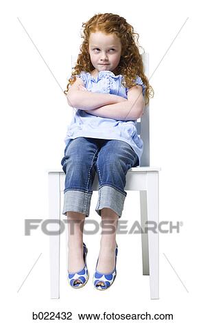 Stock Image - girl sitting in a chair. Fotosearch