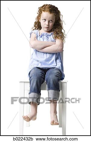 girl sitting in a chair View Large Photo Image Stock Image - girl sitting in a chair. Fotosearch