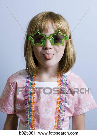 Stock Image - girl sticking out tongue. Fotosearch