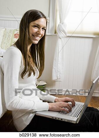 girl using a laptop View Large Photo Image Stock Photo - girl using a laptop. Fotosearch