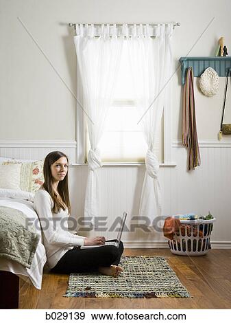 Stock Photo - girl using a laptop. Fotosearch