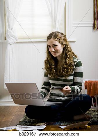Stock Photo - girl using a laptop. Fotosearch