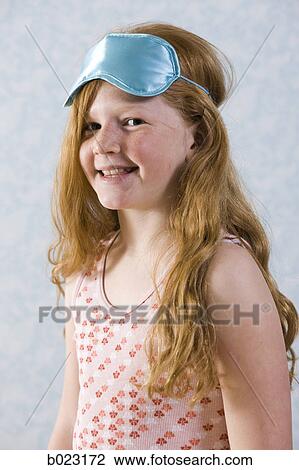 Stock Image - girl wearing an eyeshade. Fotosearch