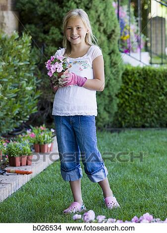 girl working in the garden View Large Photo Image Picture - girl working in the garden. Fotosearch