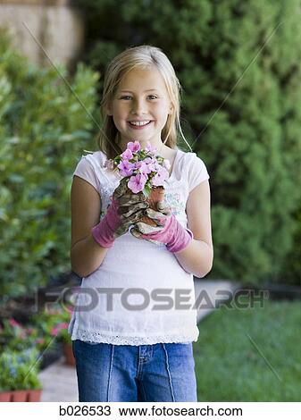 Stock Image - girl working in the garden. Fotosearch