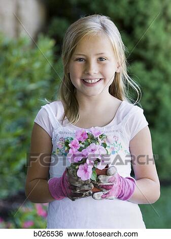 Stock Photograph - girl working in the garden. Fotosearch