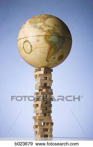 Stock Photo - globe on a tower of blocks. Fotosearch
