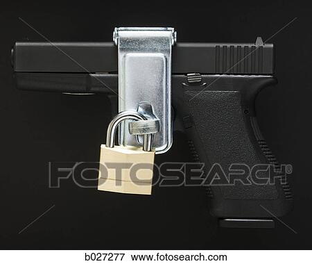 Stock Photo - glock handgun with a padlock on it. Fotosearch