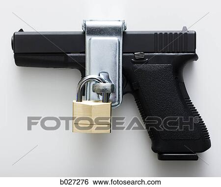 glock handgun with a padlock on it View Large Photo Image Stock Photograph - glock handgun with a padlock on it. Fotosearch