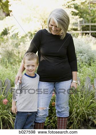 grandmother and grandson in the garden View Large Photo Image Stock Photo - grandmother and grandson in the garden. Fotosearch