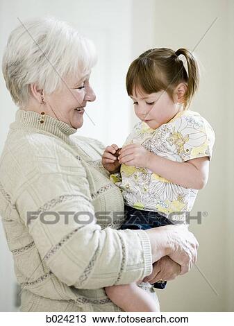 grandmother holding granddaughter View Large Photo Image Stock Image - grandmother holding granddaughter. Fotosearch
