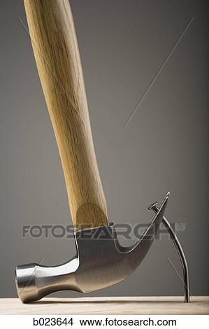 hammer removing a nail View Large Photo Image Picture - hammer removing a nail. Fotosearch