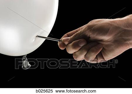 hand about to pop a balloon with a nail View Large Photo Image Stock Photography - hand about to pop a balloon with a nail. Fotosearch