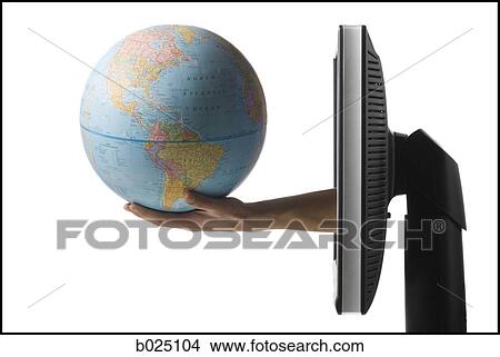 hand coming out of computer holding a globe View Large Photo Image Picture - hand coming out of computer holding a globe. Fotosearch