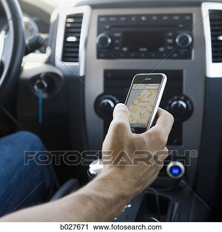 hand holding a cell phone with a map on it View Large Photo Image Stock Image - hand holding a cell phone with a map on it. Fotosearch