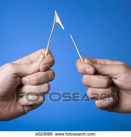 hand holding a wishbone View Large Photo Image Stock Photo - hand holding a wishbone. Fotosearch