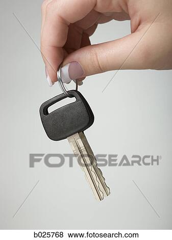 hand holding out a car key View Large Photo Image Stock Photo - hand holding out a car key. Fotosearch