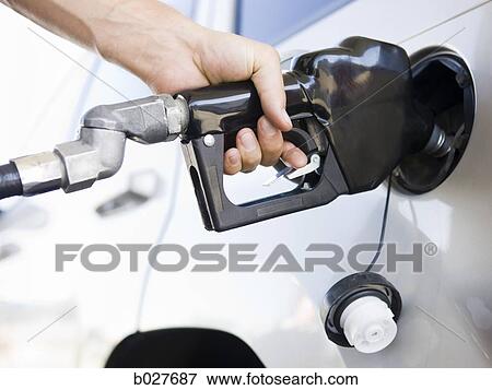 hand pumping gas into a car View Large Photo Image Stock Photo - hand pumping gas into a car. Fotosearch