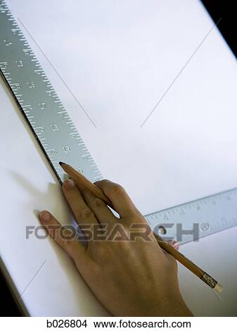 hand using a square on a drafting table View Large Photo Image Picture - hand using a square on a drafting table. Fotosearch