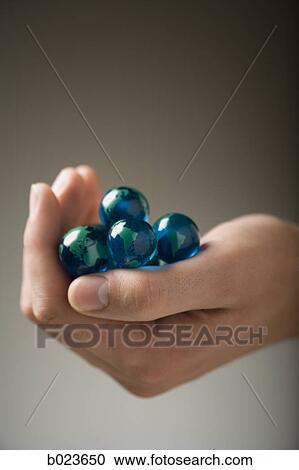 handful of marbles View Large Photo Image Stock Image - handful of marbles. Fotosearch