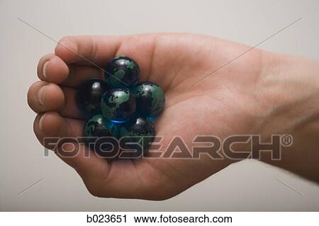 handful of marbles View Large Photo Image Stock Image - handful of marbles. Fotosearch