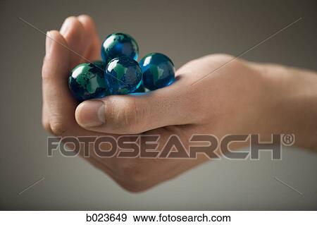 handful of marbles View Large Photo Image Stock Photo - handful of marbles. Fotosearch