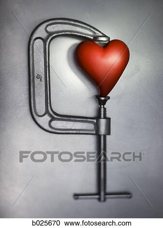 heart in a clamp View Large Photo Image Stock Image - heart in a clamp. Fotosearch