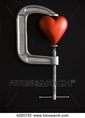 heart in a clamp View Large Photo Image Stock Image - heart in a clamp. Fotosearch