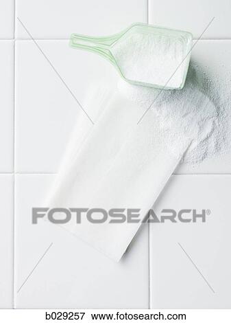 laundry detergent and dryer sheet on a white tile countertop View Large Photo Image Stock Photo - laundry detergent and dryer sheet on a white tile countertop. Fotosearch