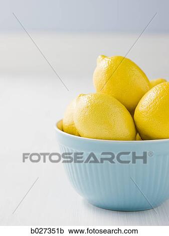 lemons in a blue bowl View Large Photo Image Stock Image - lemons in a blue bowl. Fotosearch