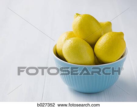 lemons in a blue bowl View Large Photo Image Stock Image - lemons in a blue bowl. Fotosearch