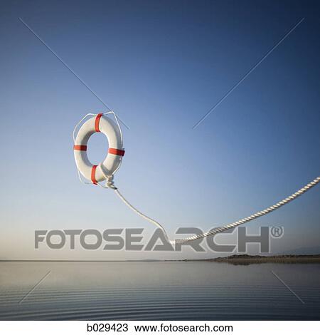 life preserver being thrown into a lake View Large Photo Image Stock Image - life preserver being thrown into a lake. Fotosearch