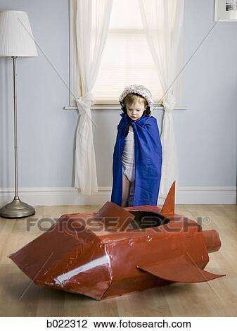 Stock Image - little boy dressed as a superhero. Fotosearch