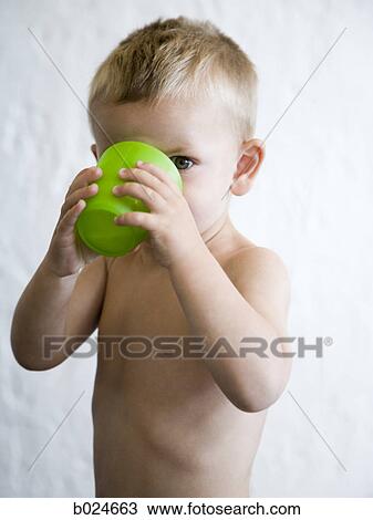 little boy drinking from a green cup View Large Photo Image Stock Image - little boy drinking from a green cup. Fotosearch