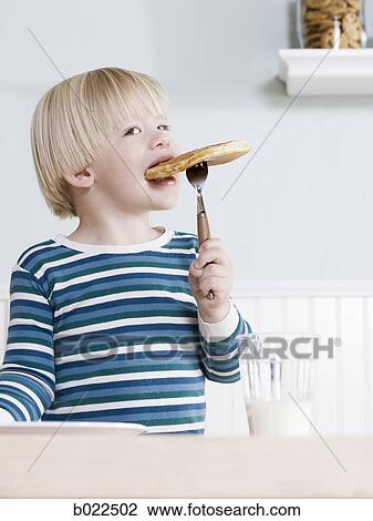 little boy eating breakfast View Large Photo Image Stock Image - little boy eating breakfast. Fotosearch