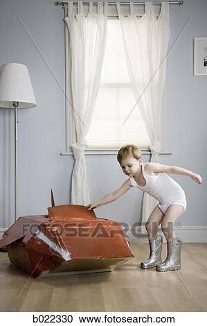 little boy in his room with a red rocketship View Large Photo Image Stock Image - little boy in his room with a red rocketship. Fotosearch
