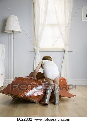 little boy in his room with a red rocketship View Large Photo Image Stock Image - little boy in his room with a red rocketship. Fotosearch