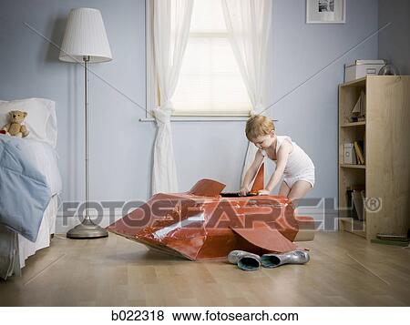 little boy in his room with a red rocketship View Large Photo Image Stock Photo - little boy in his room with a red rocketship. Fotosearch