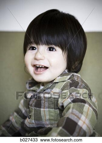 little boy on a couch View Large Photo Image Stock Image - little boy on a couch. Fotosearch