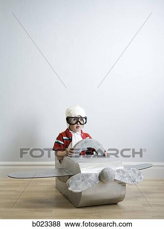 Stock Photo - little boy playing dress up. Fotosearch