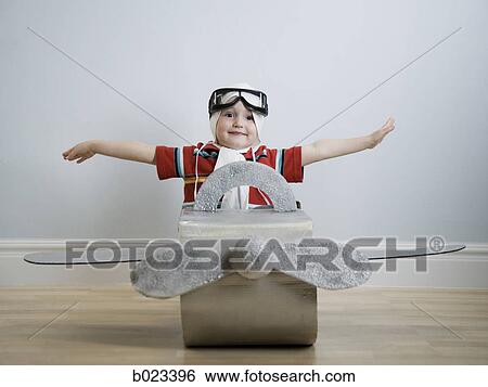 Stock Photograph - little boy playing dress up. Fotosearch