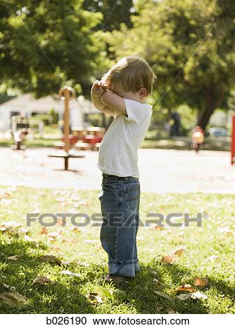 little boy playing hide and go seek View Large Photo Image Stock Image - little boy playing hide and go seek. Fotosearch